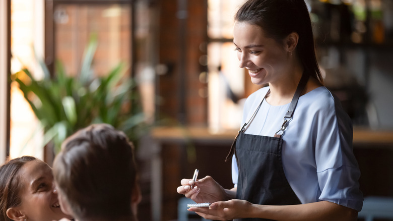 Waitress taking order at restaurant