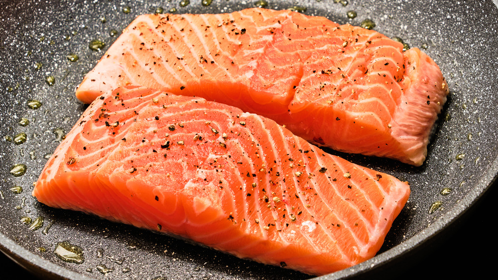 Salmon cooking on stove