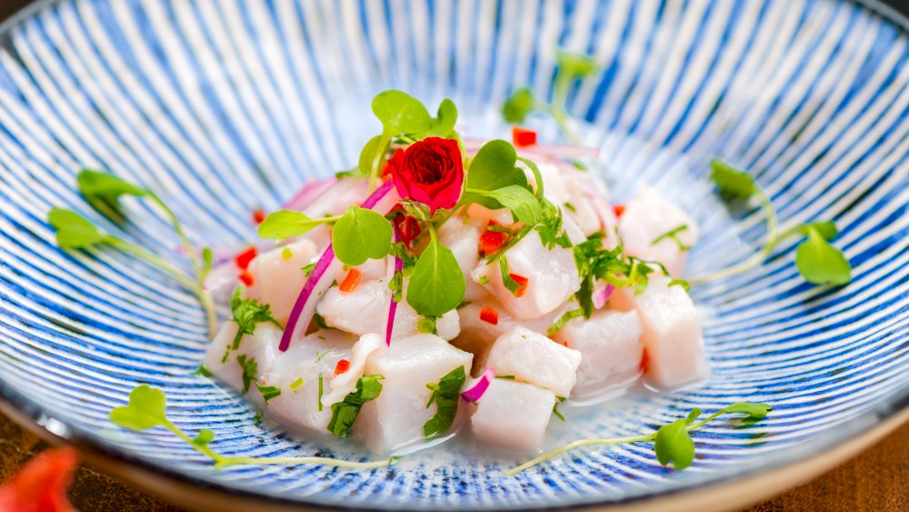 Ceviche in blue bowl with watercress