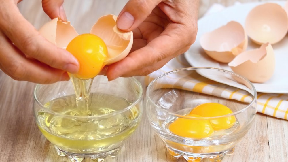 person separating an egg