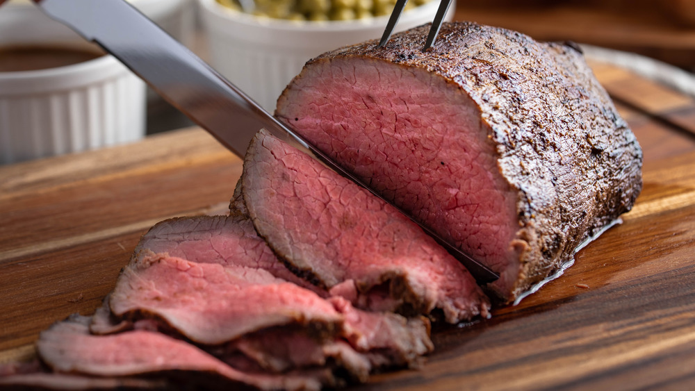 Eye of round steak being sliced