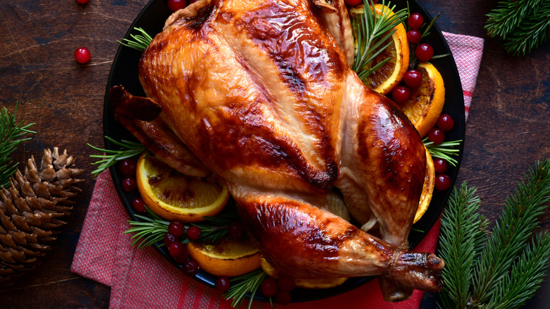 Roast chicken on platter with garnish