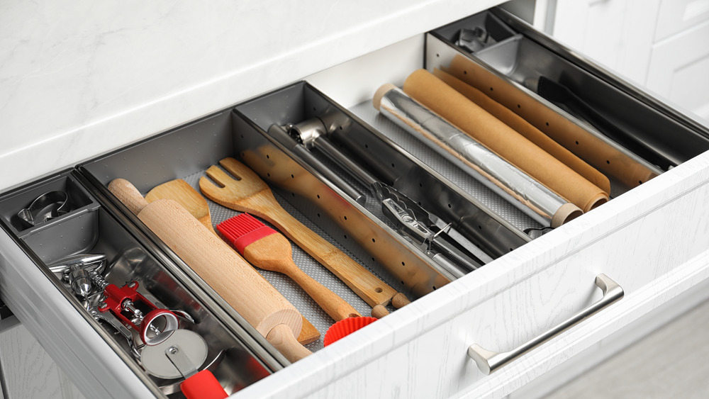 A kitchen drawer full of cooking tools