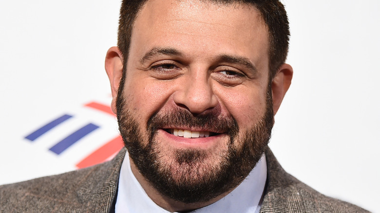 Adam Richman smiling at event