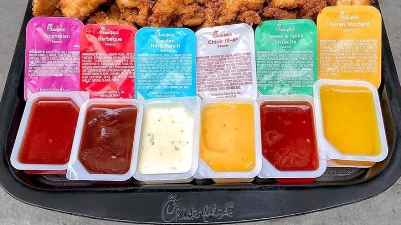 Open Chick-fil-A sauce packets