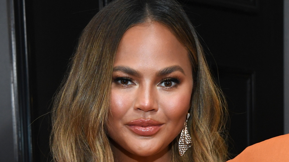 Chrissy Teigen with sparkly earrings