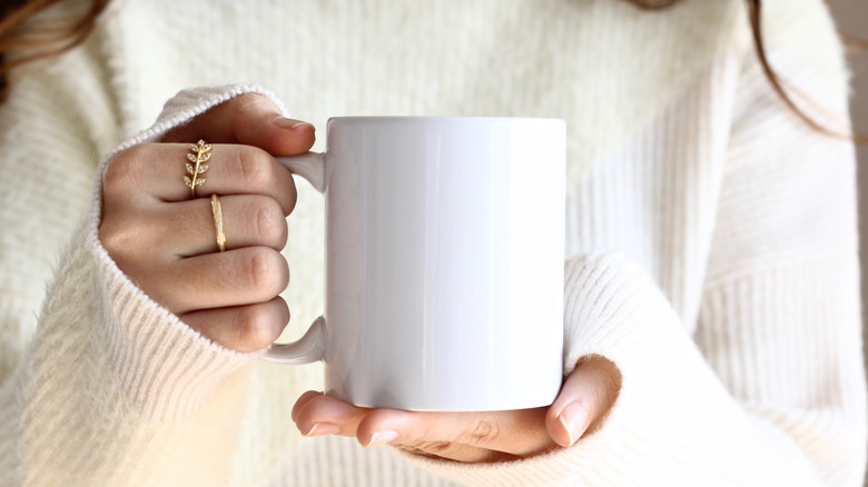woman holding coffee mug