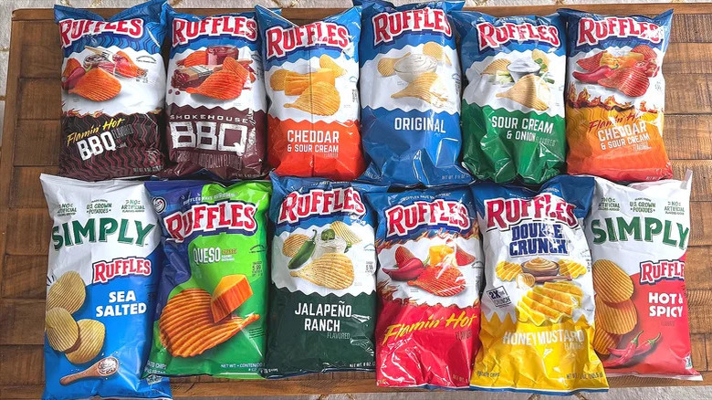 An assortment of Ruffles-brand potato chips in various flavors