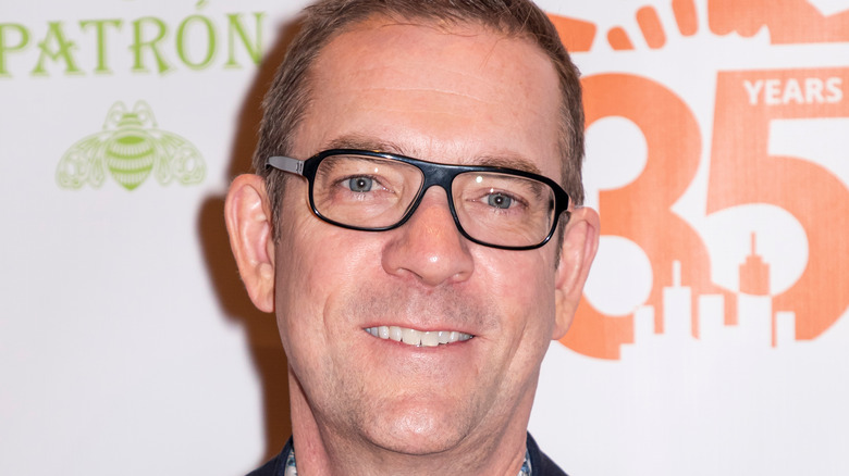 Ted Allen smiling and posing at an event