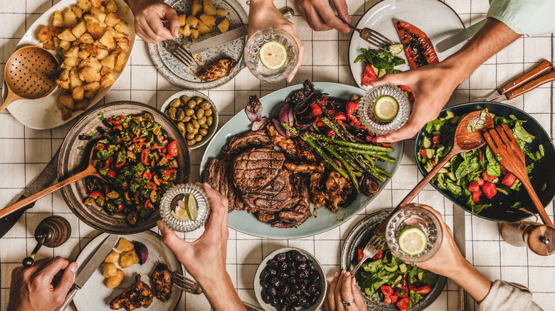 Dishes of food spread across table