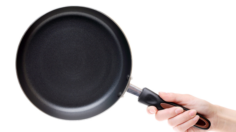 Nonstick skillet in hand