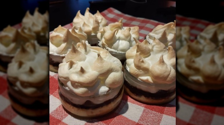 Dishes of custard, fruit, and meringue