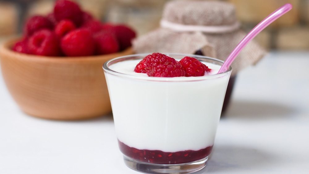 Fresh yogurt topped with raspberries 
