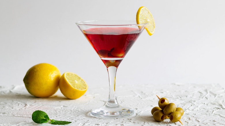 Cosmopolitan martini with lemons and olives 