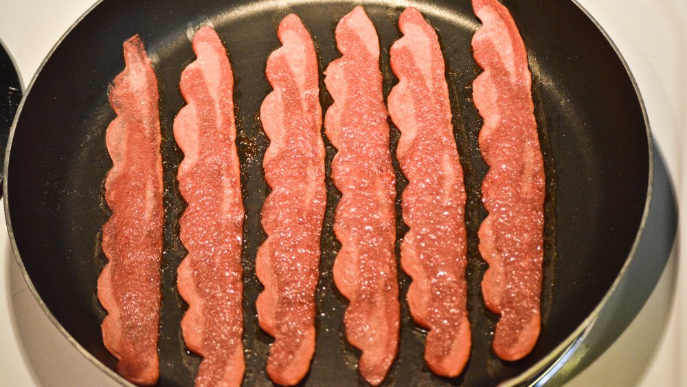 turkey bacon in a frying pan