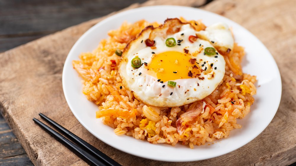 fried rice with an egg on top