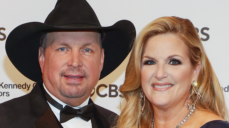 Trisha Yearwood and Garth Brooks in a cowboy hat