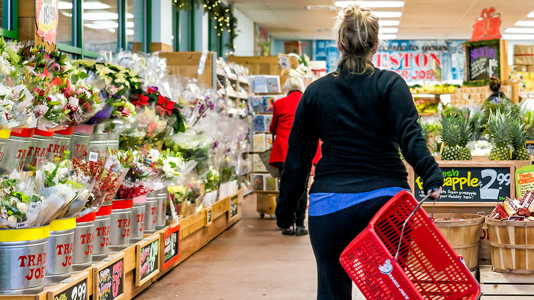 Woman entering Trader Joe's