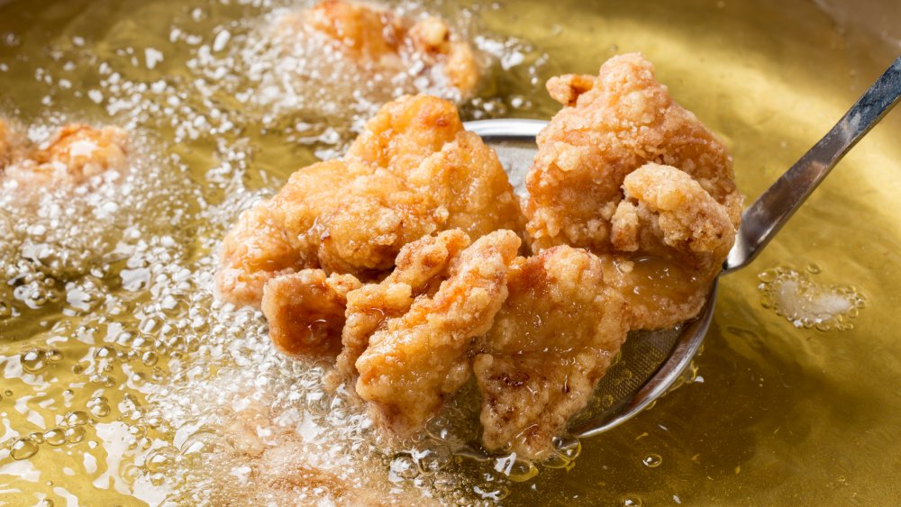chicken frying in oil