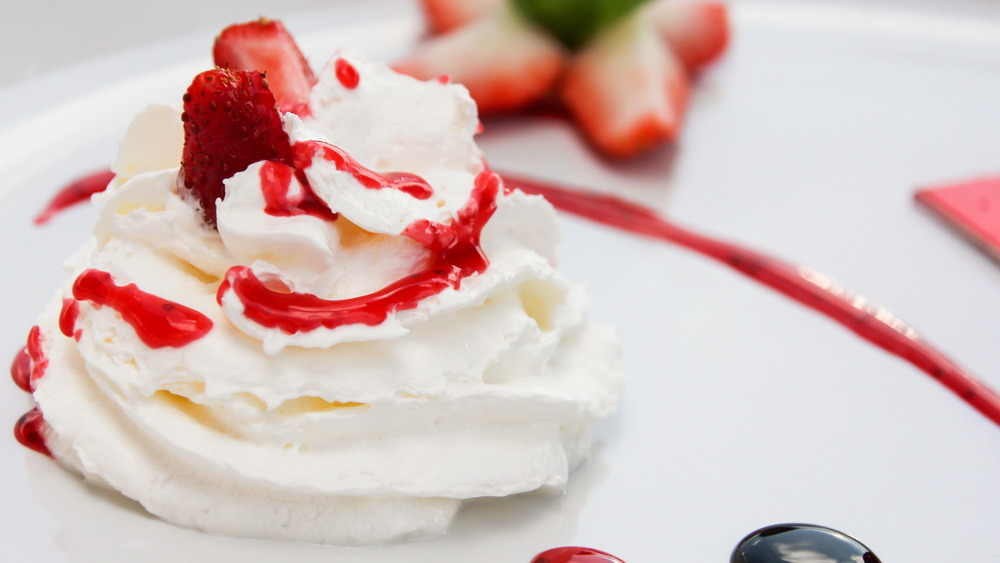 Whipped cream with strawberry sauce