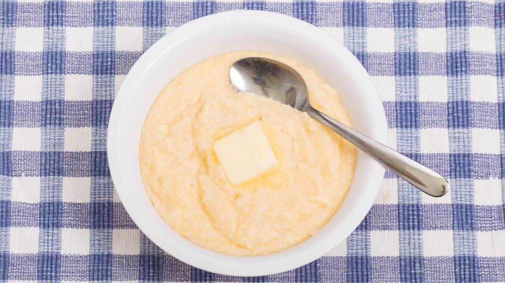 A bowl of grits with butter