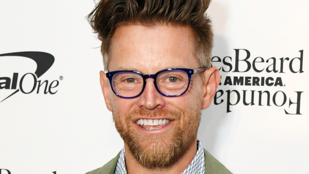 Richard Blais smiling with glasses