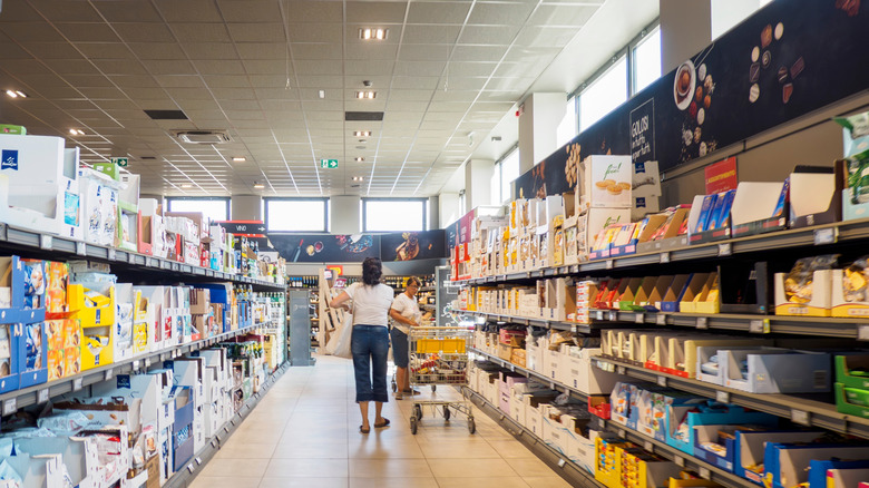 Lone customer shopping in an aisle at Aldi