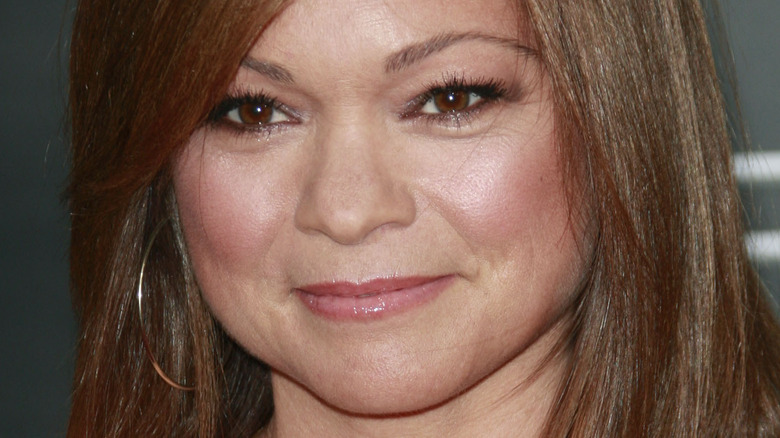 Valerie Bertinelli with hoop earrings and slight smile