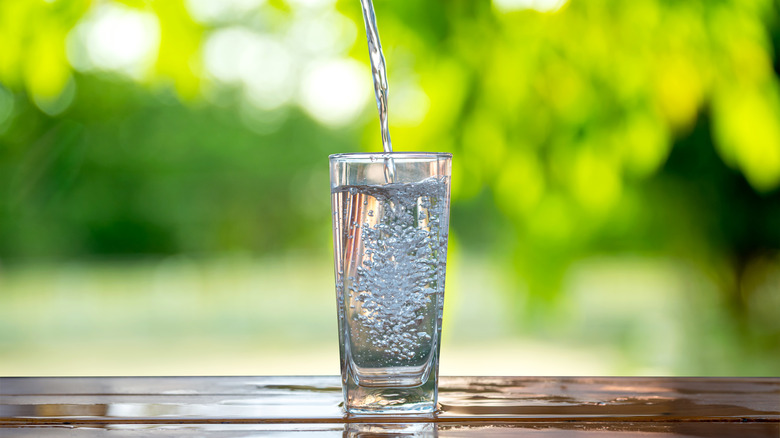 water flowing into glass