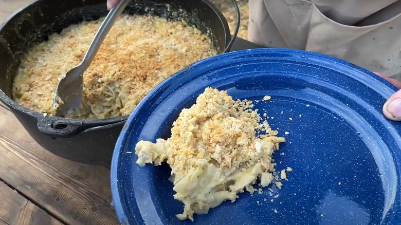 Tuna casserole in a pot by Cowboy Kent Rollins scooped into a blue plate