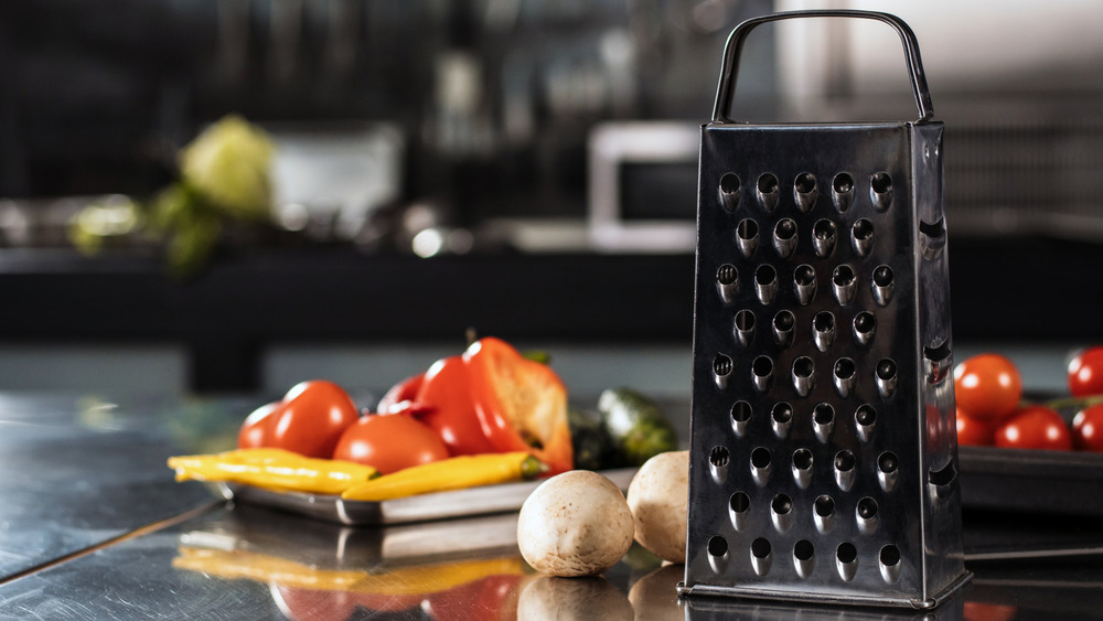 A box grater with vegetables