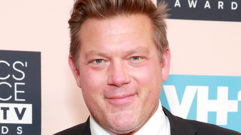 Tyler Florence wearing a suit on white background