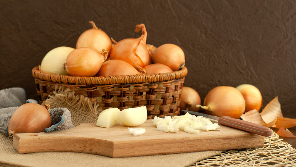 Chopped white onions on a cutting board 