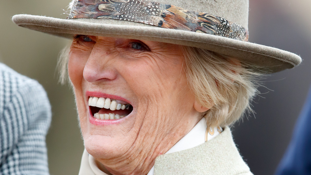 Mary Berry in a hat laughing