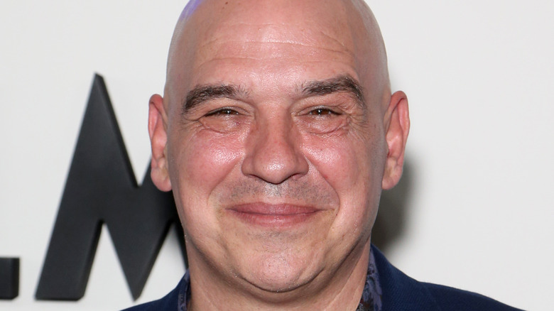 Michael Symon smiling on red carpet