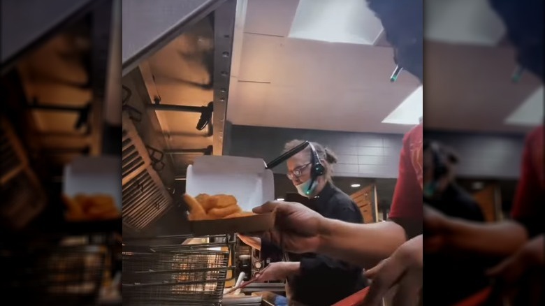 McDonald's worker frying chicken nuggets