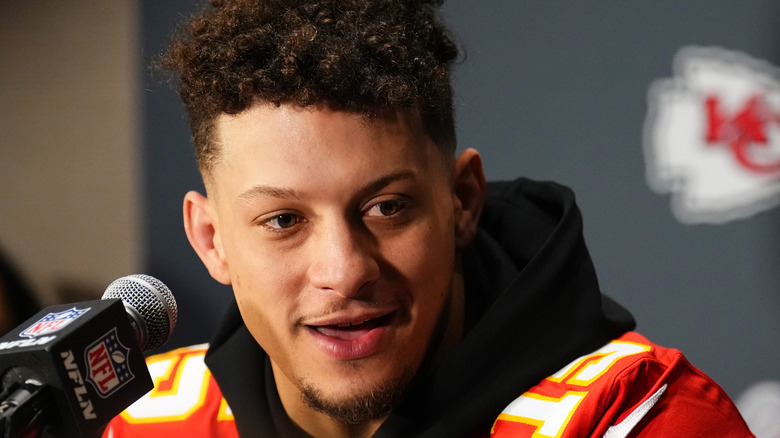 Patrick Mahomes speaking into microphone