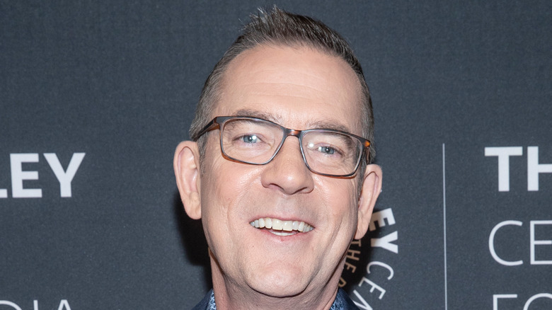 Ted Allen posing at event