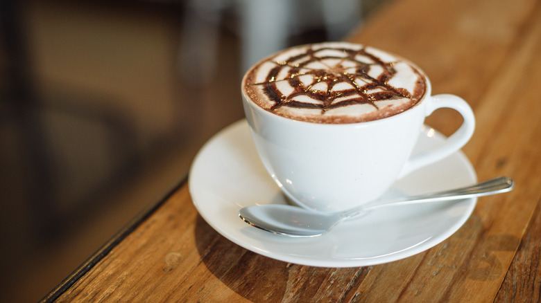 A cup of cafe mocha on a table