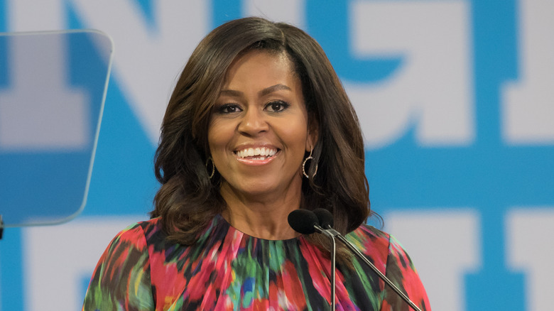 Michelle Obama in front of microphone