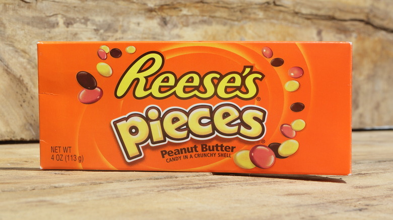 Box of Reese's Pieces on wood surface