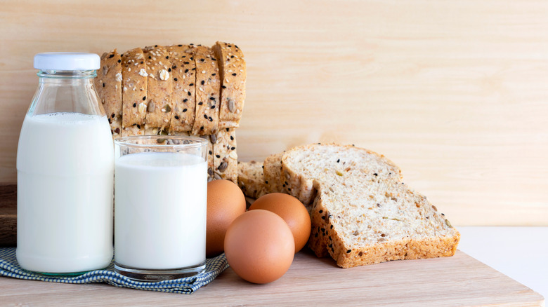 Milk, bread and eggs on a table