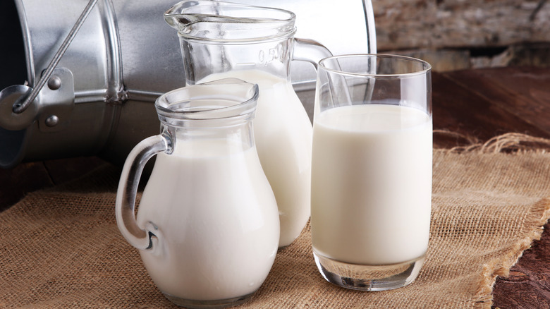 Pitchers and glass of milk