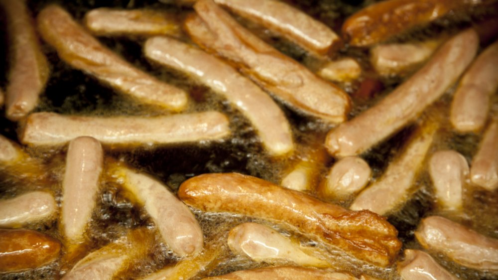Rutt's Hut hot dogs cooking in a deep fryer