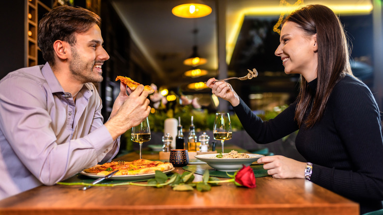 couple on a fancy date eating Italian food