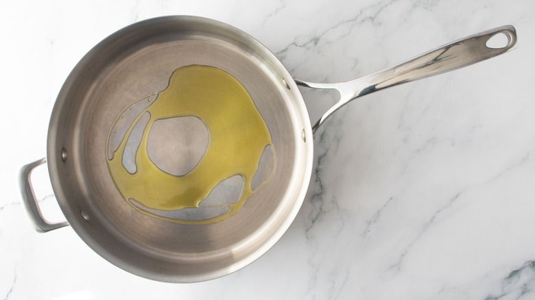 Drizzle of oil in pan
