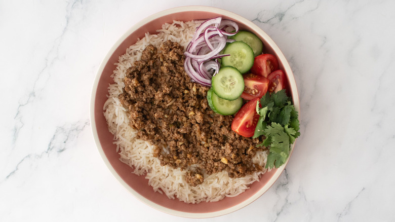 Ground beef keema rice bowl topped with veggies