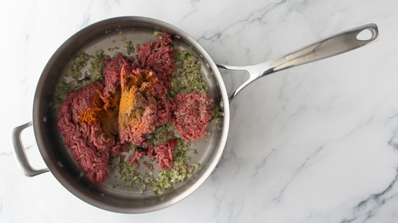 Ground beef and spices in pan