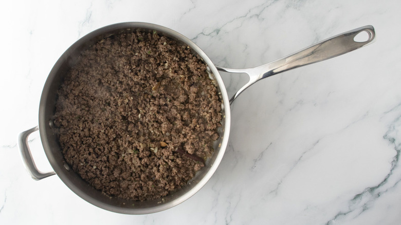 Cooked ground beef in pan