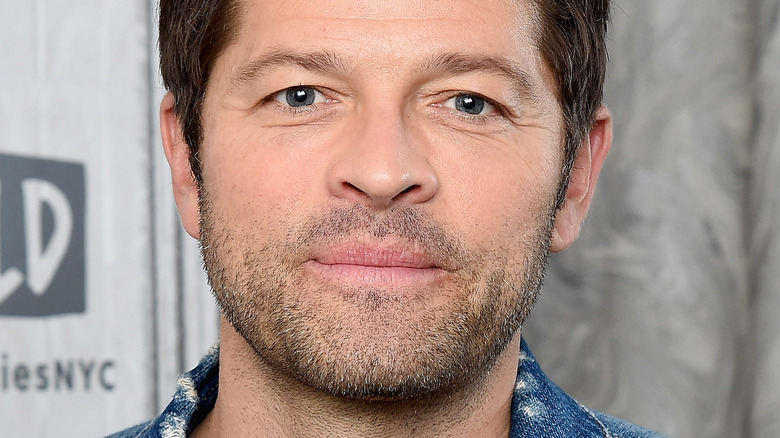 Misha Collins posing at an event